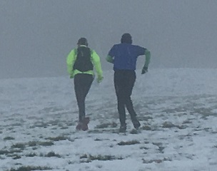 trail runners in snow